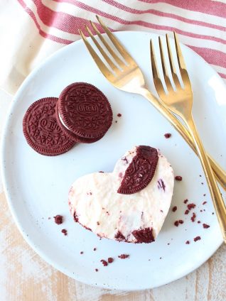 These delicious no bake cheesecake bars with a Red Velvet Oreo crust are sweet, decadent and can be cut into heart shapes for a cute Valentine's Day Treat!