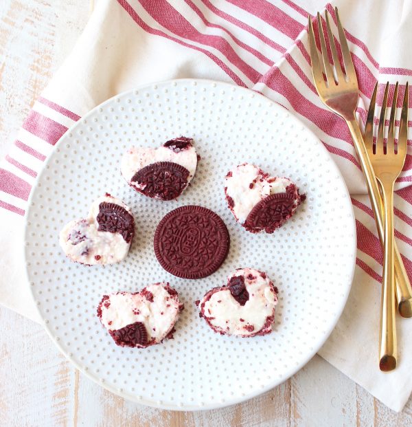 These delicious no bake cheesecake bars with a Red Velvet Oreo crust are sweet, decadent and can be cut into heart shapes for a cute Valentine's Day Treat!