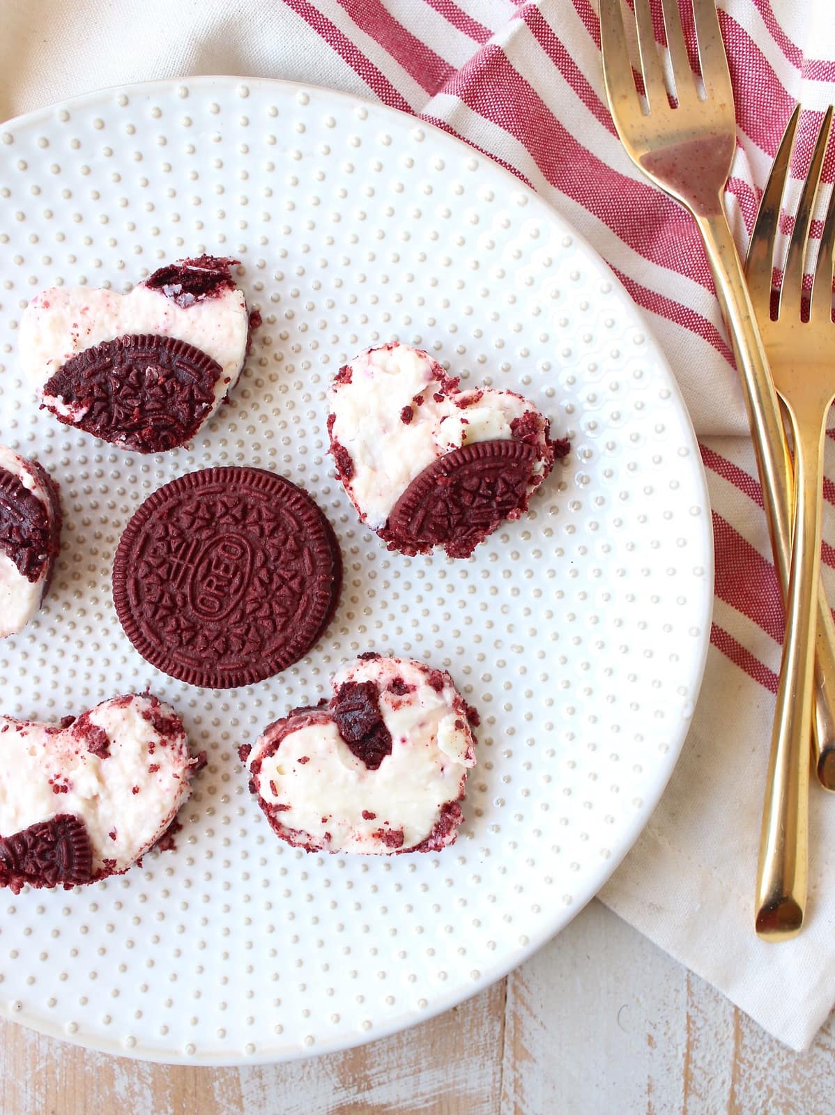 These delicious no bake cheesecake bars with a Red Velvet Oreo crust are sweet, decadent and can be cut into heart shapes for a cute Valentine's Day Treat!