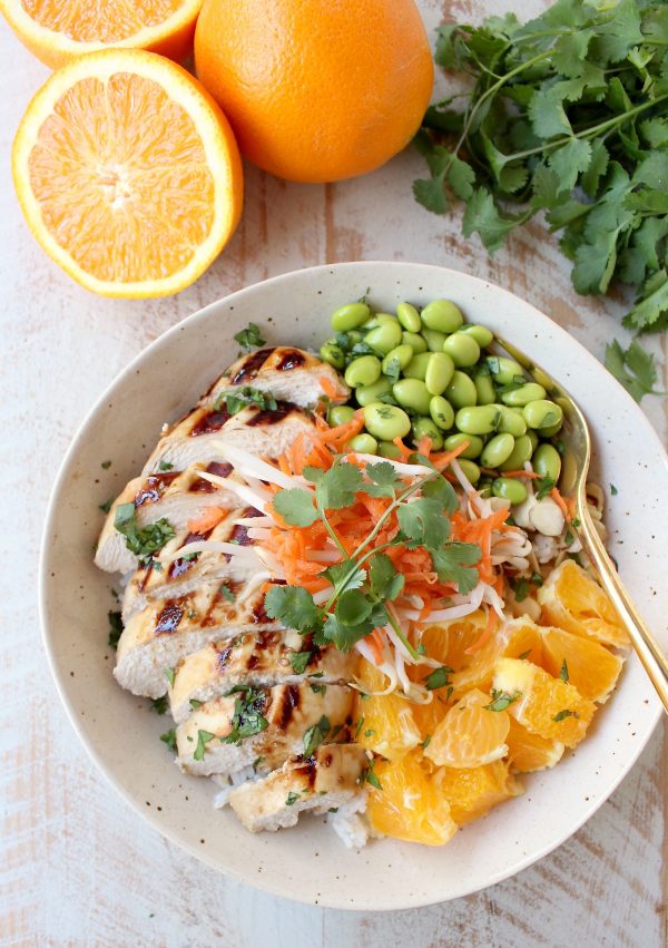 Sesame ginger marinated & grilled chicken tops these Healthy Asian Chicken Rice Bowls filled with oranges, almonds, veggies & tons of flavor!