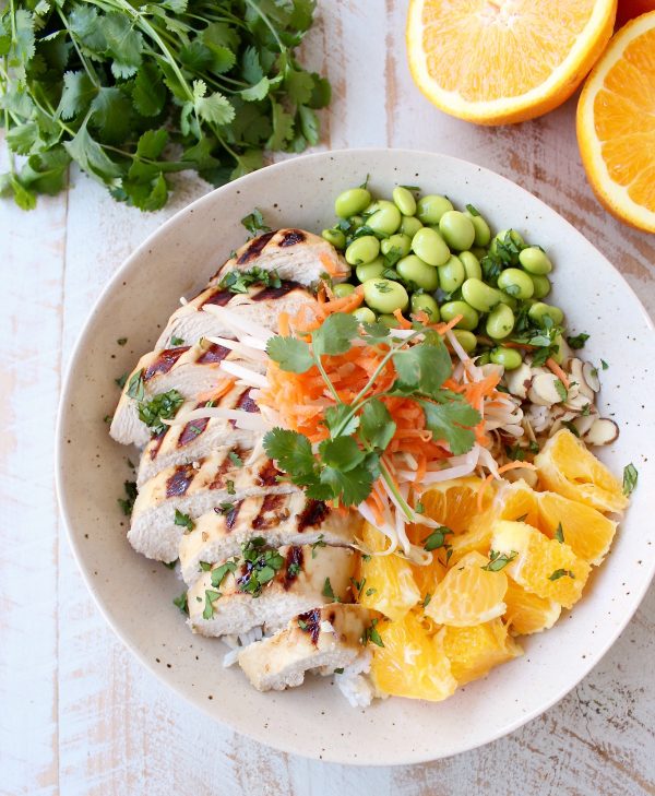 Sesame ginger marinated & grilled chicken tops these Healthy Asian Chicken Rice Bowls filled with oranges, almonds, veggies & tons of flavor!