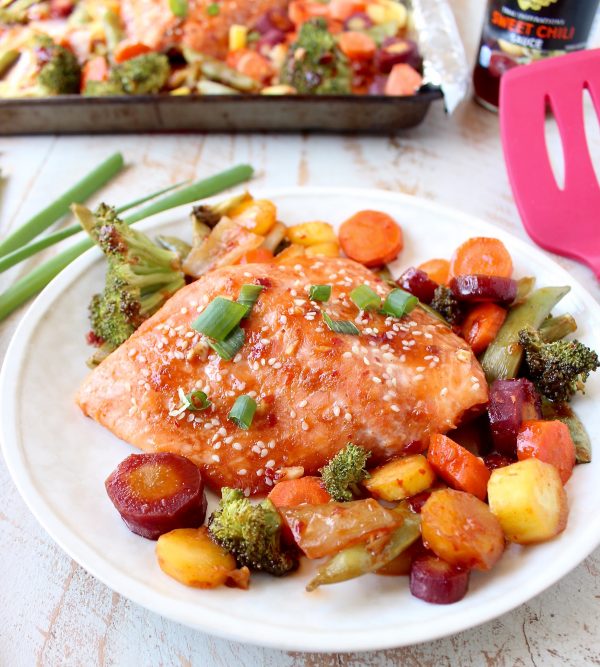 This Sheet Pan Salmon recipe with Thai Sweet Chili Sauce is easy to make in 29 minutes, it's gluten free, healthy & baked with veggies for a complete meal!