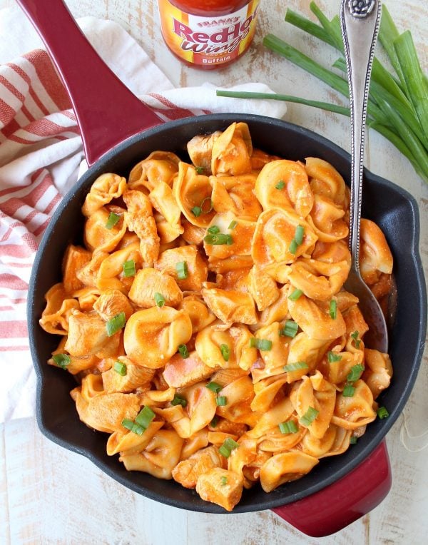 Buffalo chicken and cheese tortellini are cooked in one pot in a cheesy buffalo sauce for a seriously delicious meal made in only 20 minutes!