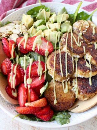 Crispy goat cheese, creamy avocado & juicy strawberries top spinach & arugula, tossed with avocado vinaigrette, for the perfect vegetarian Spring salad!