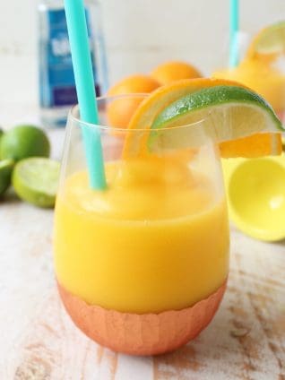 Mango, fresh squeezed orange and lime juice, tequila and triple sec are combined in this deliciously light & refreshing Frozen Mango Margarita Recipe!