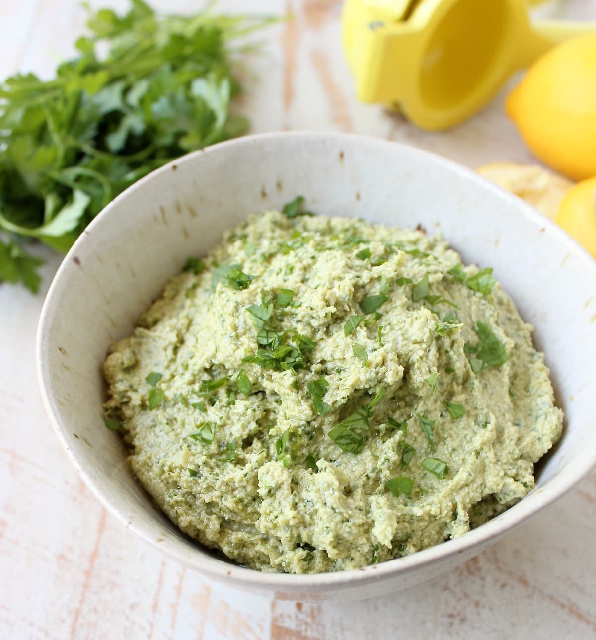 This healthy, vegan and gluten free Green Tahini Sauce Recipe is perfect for topping buddha bowls, chicken and fish, or serve it as a dip with veggies!