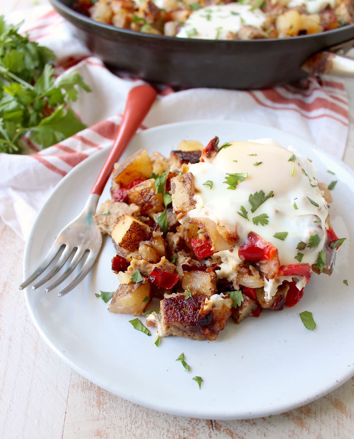 Leftover Bacon Wrapped Meatloaf is transformed into one seriously delicious one pot breakfast in this Meatloaf Hash Recipe with potatoes, onions & eggs!