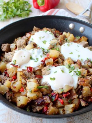 Leftover Bacon Wrapped Meatloaf is transformed into one seriously delicious one pot breakfast in this Meatloaf Hash Recipe with potatoes, onions & eggs!