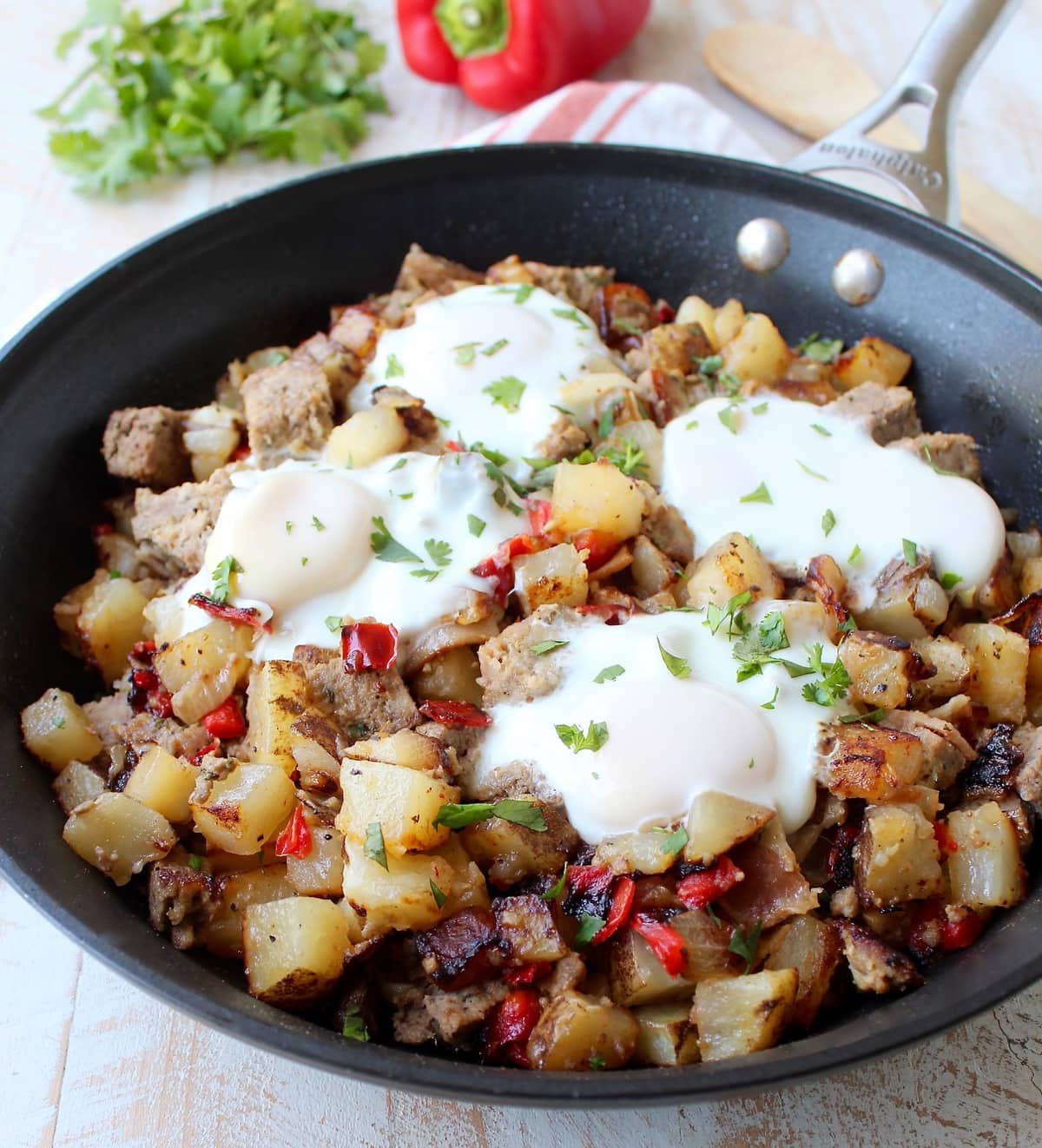 Leftover Bacon Wrapped Meatloaf is transformed into one seriously delicious one pot breakfast in this Meatloaf Hash Recipe with potatoes, onions & eggs!