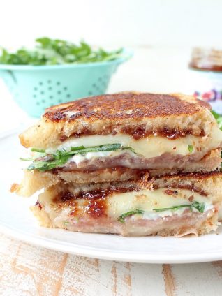 This Provolone Grilled Cheese Sandwich recipe is filled with prosciutto, blue cheese, arugula & fig jam for a flavorful, delicious & filling sandwich!