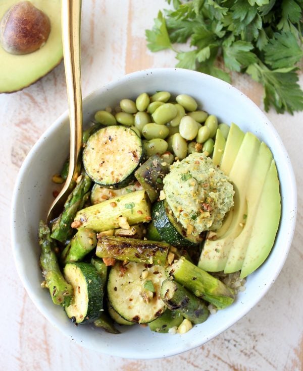 The Green Vegan Buddha Bowl is filled with grilled veggies, green tahini sauce, avocado & quinoa for a healthy, filling meal that's also gluten free!