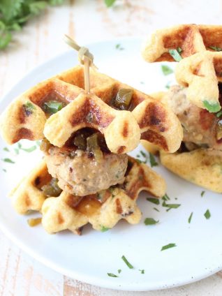 Jalapeño Honey Chicken & Pork Meatballs are sandwiched between Jalapeño Bacon Cornbread Waffles in this delicious recipe for Meatball Sliders, putting a new, fun twist on chicken & waffles!