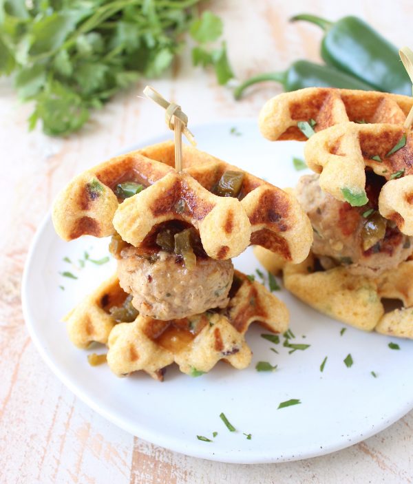 Jalapeño Honey Chicken & Pork Meatballs are sandwiched between Jalapeño Bacon Cornbread Waffles in this delicious recipe for Meatball Sliders, putting a new, fun twist on chicken & waffles!