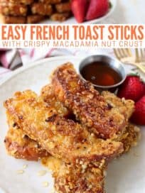 crispy french toast sticks stacked up on plate