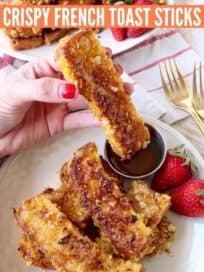 crispy french toast stick dipped into honey