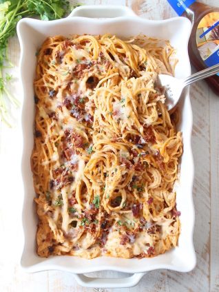 This creamy, dreamy Baked Spaghetti recipe is tossed in a cheesy, bbq sauce with shredded chicken & crispy bacon for a delicious meal made in under an hour!