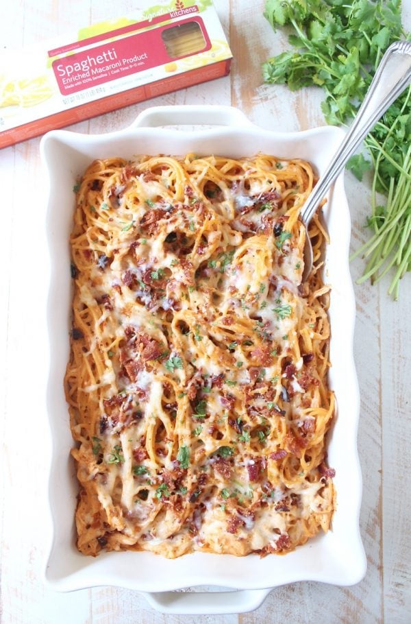 This creamy, dreamy Baked Spaghetti recipe is tossed in a cheesy, bbq sauce with shredded chicken & crispy bacon for a delicious meal made in under an hour!