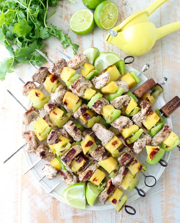 Jerk chicken kabobs with pineapple and bell peppers, the perfect 5-ingredient, gluten free recipe to toss on the grill and serve with honey lime sauce!
