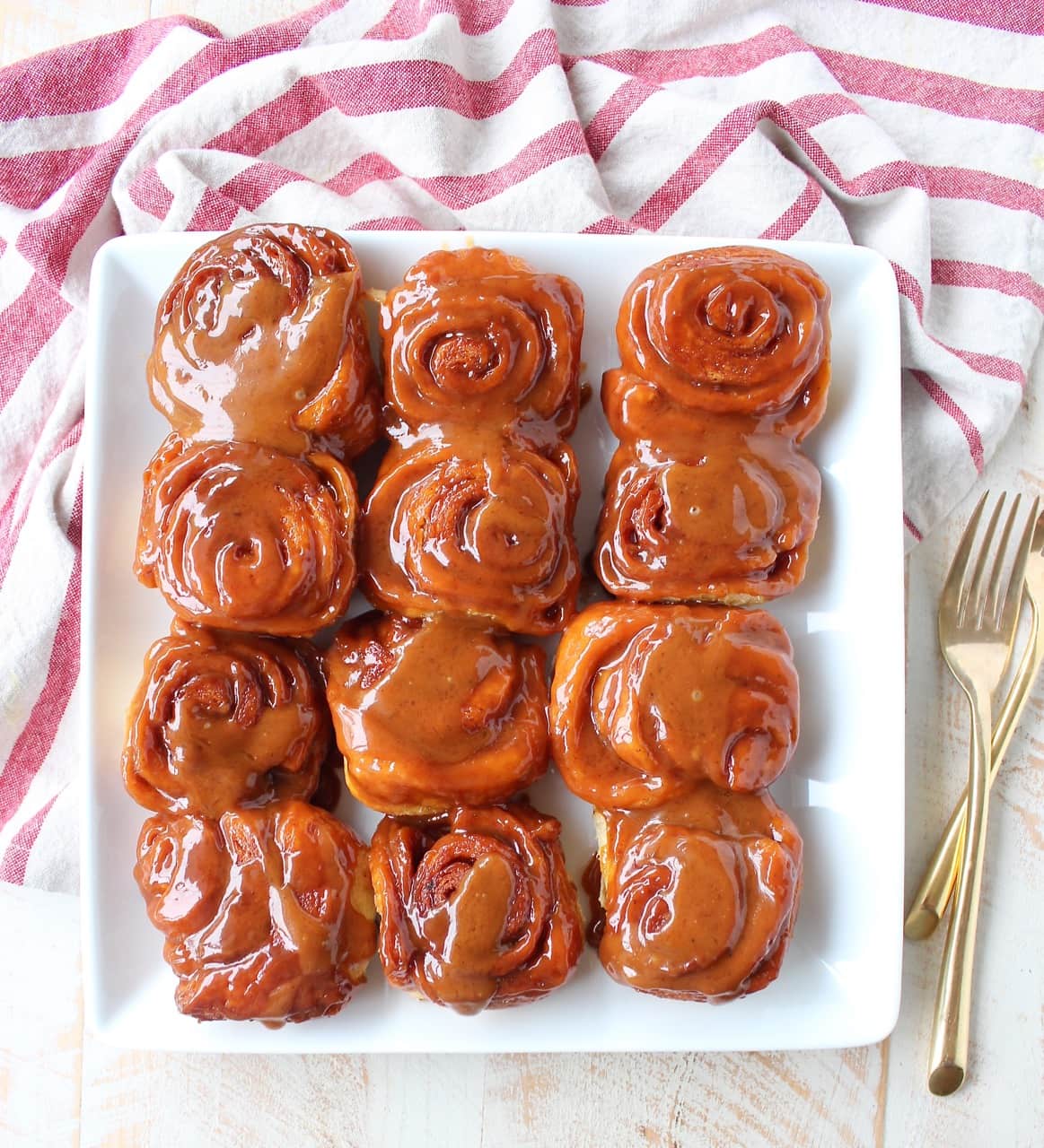 Salted Caramel Cinnamon Rolls on white square plate