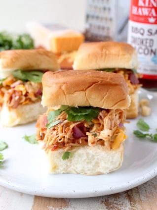 These scrumptious BBQ Chicken Salad Sliders are made with BBQ chicken tossed with cheddar cheese, bacon, corn & onions, served on sweet Hawaiian rolls!