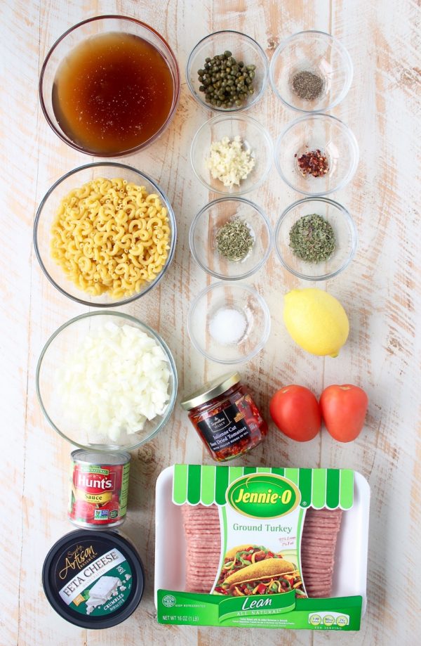 In just one pot and under 45 minutes, make a delicious Greek Pasta recipe filled with sun dried tomatoes, ground turkey, capers and feta cheese!