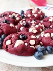 Red Velvet Cookies are filled with white chocolate chips and blueberries in this colorful and patriotic dessert recipe, perfect for summer and 4th of July!