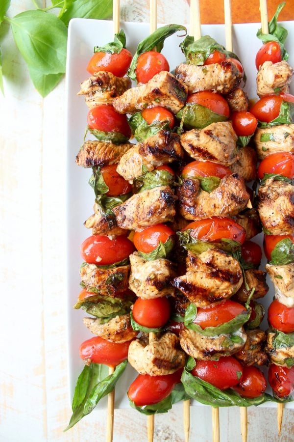 The easiest & most delicious Tomato Basil Chicken Skewers are made with marinated chicken, cherry tomatoes & fresh basil for a healthy, gluten free meal!