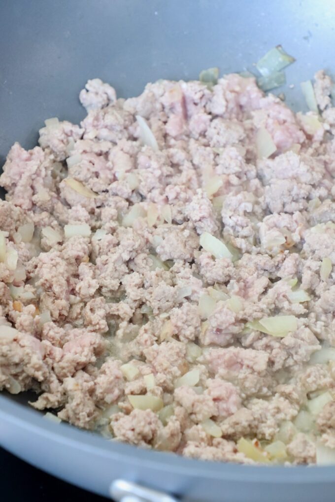 cooked ground turkey in pan with diced onions