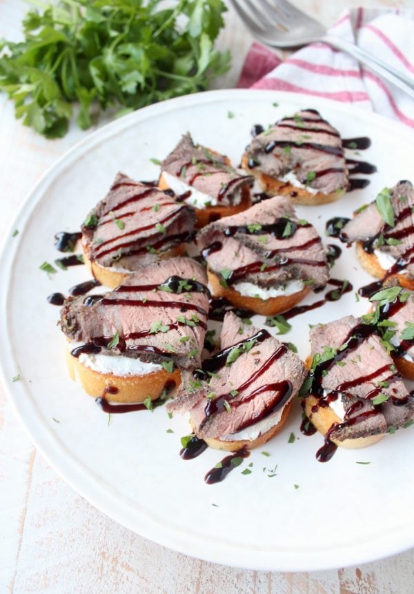 Top sirloin is seasoned & sous vide, then sliced & served atop a crispy baguette with horseradish goat cheese in this delicious steak crostini recipe!