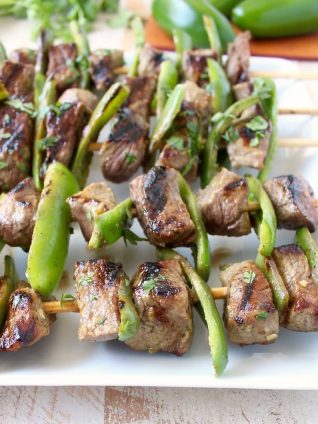 These Steak Kabobs are marinated in a delicious honey lime jalapeno marinade then skewered with fresh jalapenos & tossed on the grill for a delicious meal!