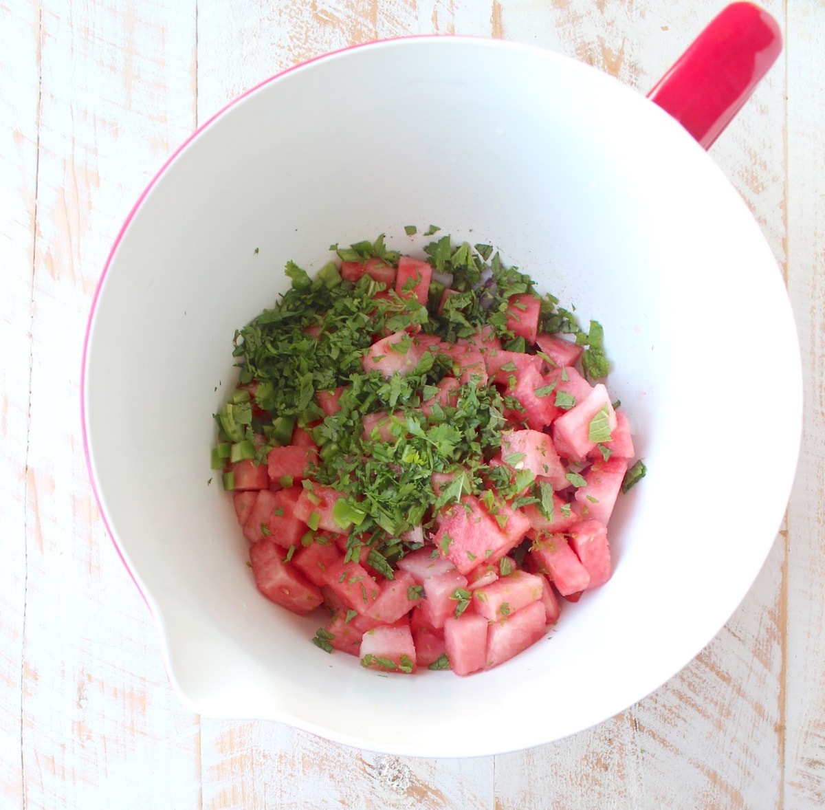 Watermelon salsa ingredients in large mixing bowl