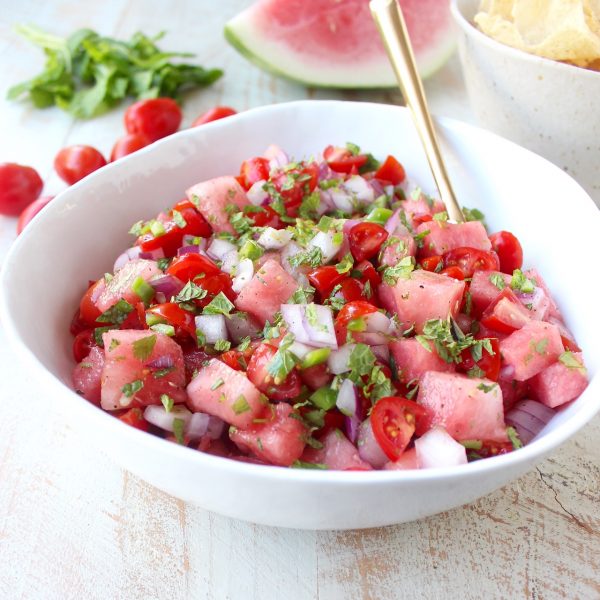 Watermelon salsa is refreshing, flavorful and will be the hit of the summer! Serve it with tortilla chips for a vegan and gluten free snack or serve it over chicken, fish or tacos for a delicious meal!