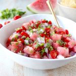 Watermelon salsa is refreshing, flavorful and will be the hit of the summer! Serve it with tortilla chips for a vegan and gluten free snack or serve it over chicken, fish or tacos for a delicious meal!