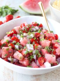 Watermelon salsa is refreshing, flavorful and will be the hit of the summer! Serve it with tortilla chips for a vegan and gluten free snack or serve it over chicken, fish or tacos for a delicious meal!