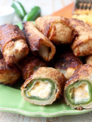 Crispy, cheesy, delicious jalapeno popper egg rolls are the perfect appetizer for parties or game day! They're also so easy to make in under 30 minutes!