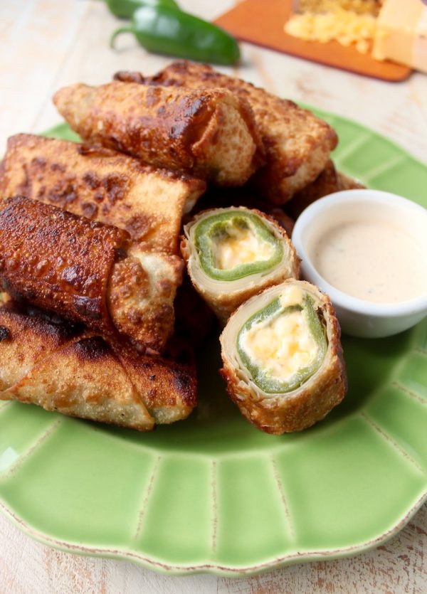 Crispy, cheesy, delicious jalapeno popper egg rolls are the perfect appetizer for parties or game day! They're also so easy to make in under 30 minutes!