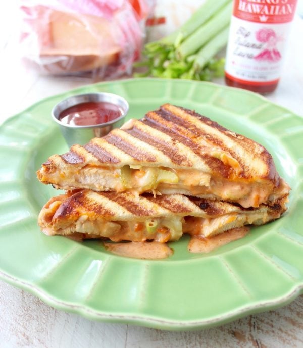 Hot sauce sautéed chicken, pepper jack cheese and a spicy, creamy sauce make up this deliciously saucy and cheesy Spicy Chicken Panini recipe!