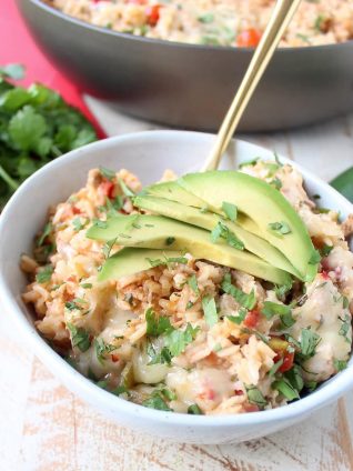 This One Pot Taco Rice Skillet recipe combines ground turkey, rice, veggies, spices & cheese for a quick and easy weeknight dinner that is so delicious!