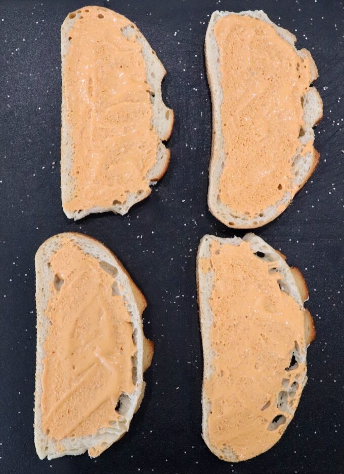 pieces of bread spread with chipotle sauce