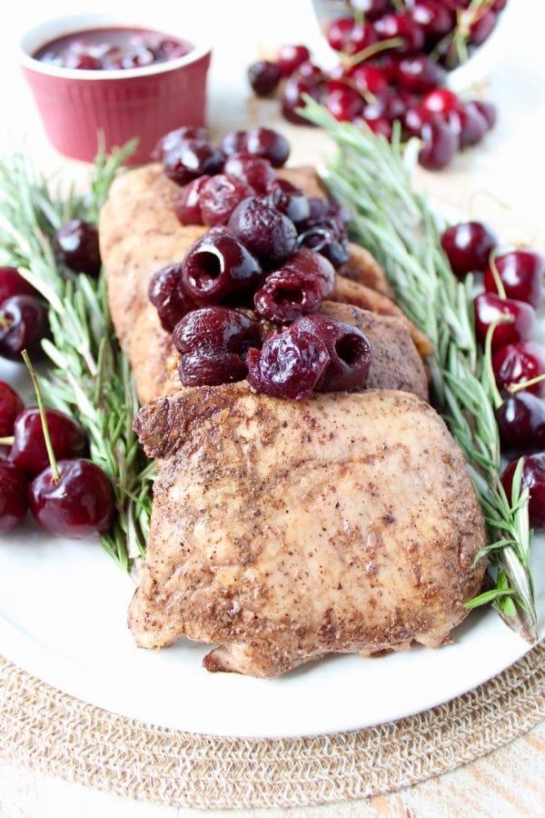Tender, juicy, flavorful pork chops are roasted in the oven, or cooked in a sous vide, then finished off with a simple and delicious cherry balsamic glaze!
