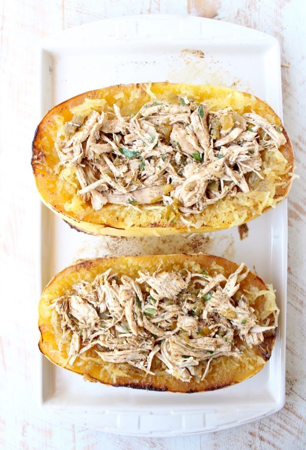roasted spaghetti squash cut in half filled with green chili chicken