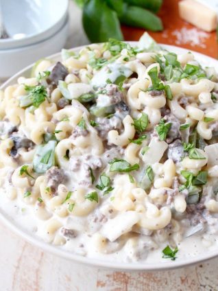 This insanely delicious Mac and Cheese recipe is a seriously scrumptious twist on the Philly Cheesesteak and it's easily made in only 29 minutes!