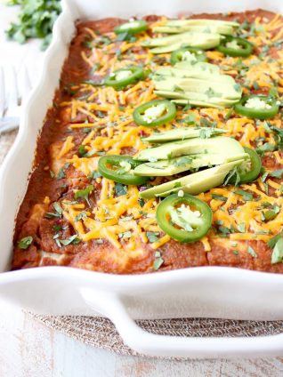 Pumpkin enchiladas put a great fall spin on the traditional Mexican dish, made with a simple red pumpkin sauce & filled with chorizo, cheese or veggies!