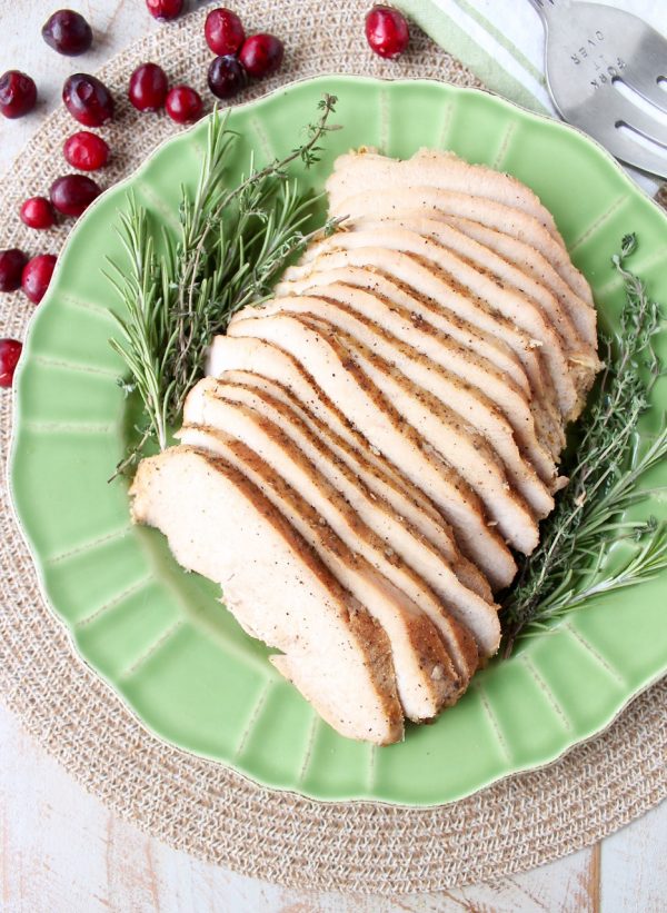 This simple slow cooker turkey breast recipe is perfect for Thanksgiving, or an easy weeknight dinner anytime! The maple apple glaze is delicious & only takes requires 4 ingredients & 5 minutes to prep!