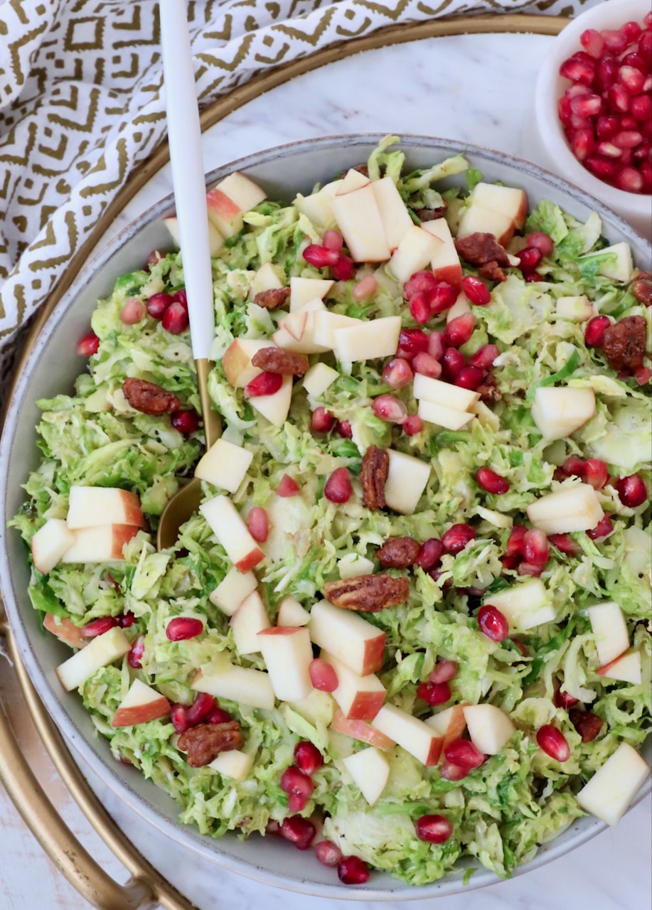 brussels sprout salad in a bowl with a spoon