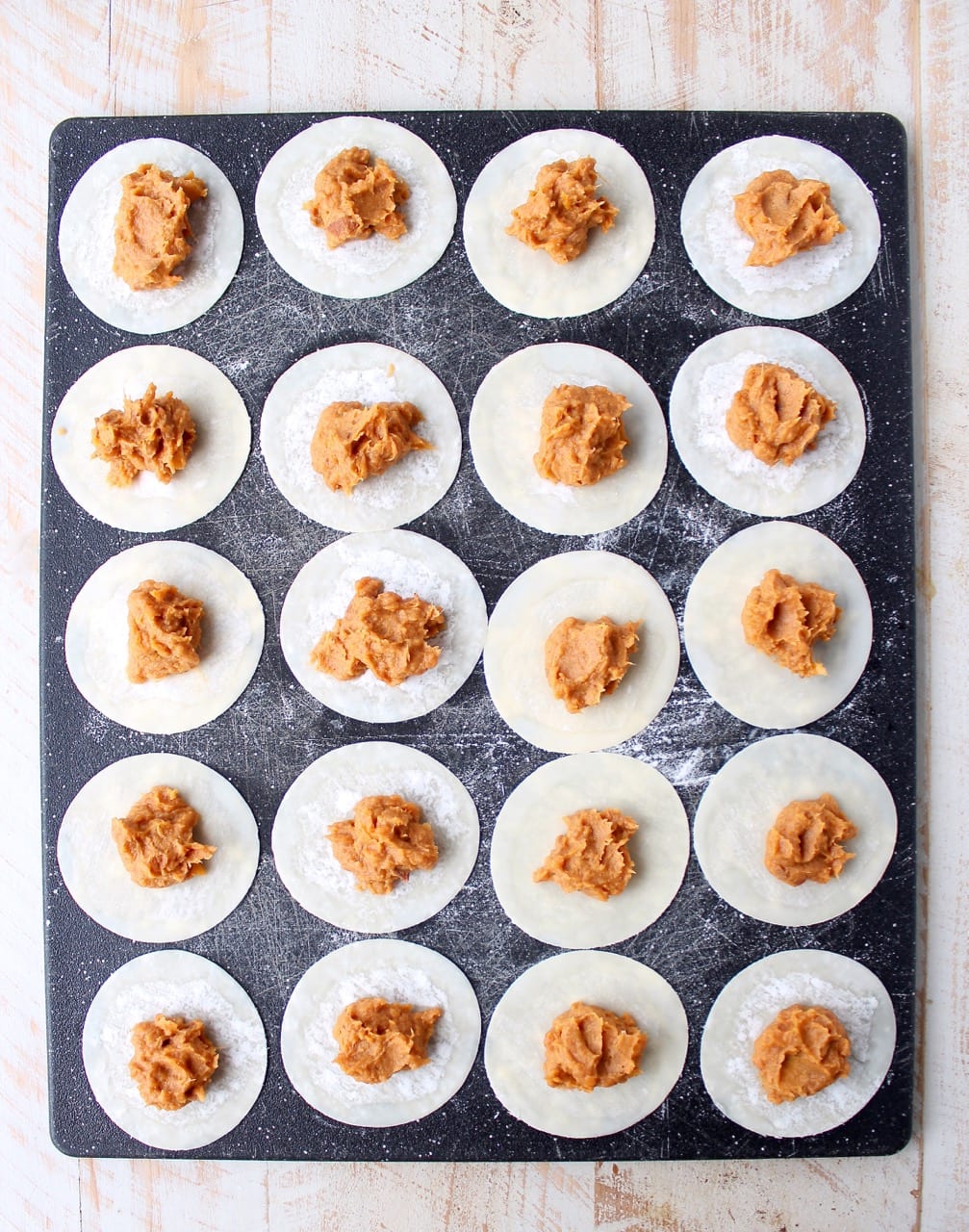 In this easy pierogies recipe, wonton wrappers are filled with leftover mashed potatoes, then pan seared with caramelized onions for a delicious meal!