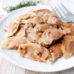 In this easy pierogies recipe, wonton wrappers are filled with leftover mashed potatoes, then pan seared with caramelized onions for a delicious meal!