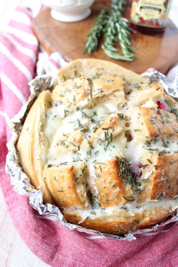 Leftover Thanksgiving turkey & cranberry sauce is made into a delicious pull apart bread recipe filled with mozzarella cheese & topped with rosemary butter!