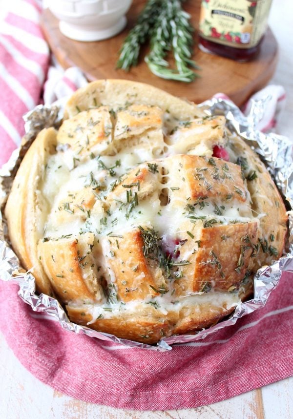 Leftover Thanksgiving turkey & cranberry sauce is made into a delicious pull apart bread recipe filled with mozzarella cheese & topped with rosemary butter!