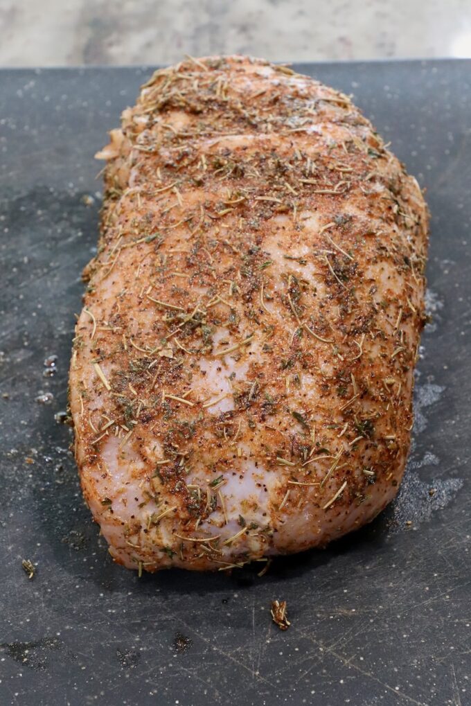 seasoned turkey breast on a cutting board